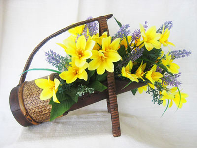 <img src="floral_wine_basket.jpg" alt="flowers in a wine basket "> 